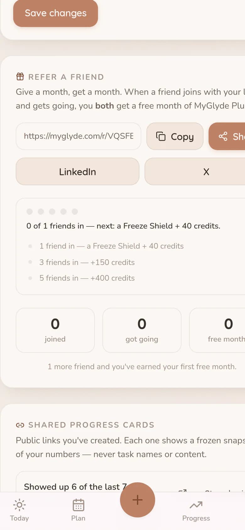 The referral link on a phone with Copy and Share buttons sized for a thumb, and the same reward ladder listed beneath it.