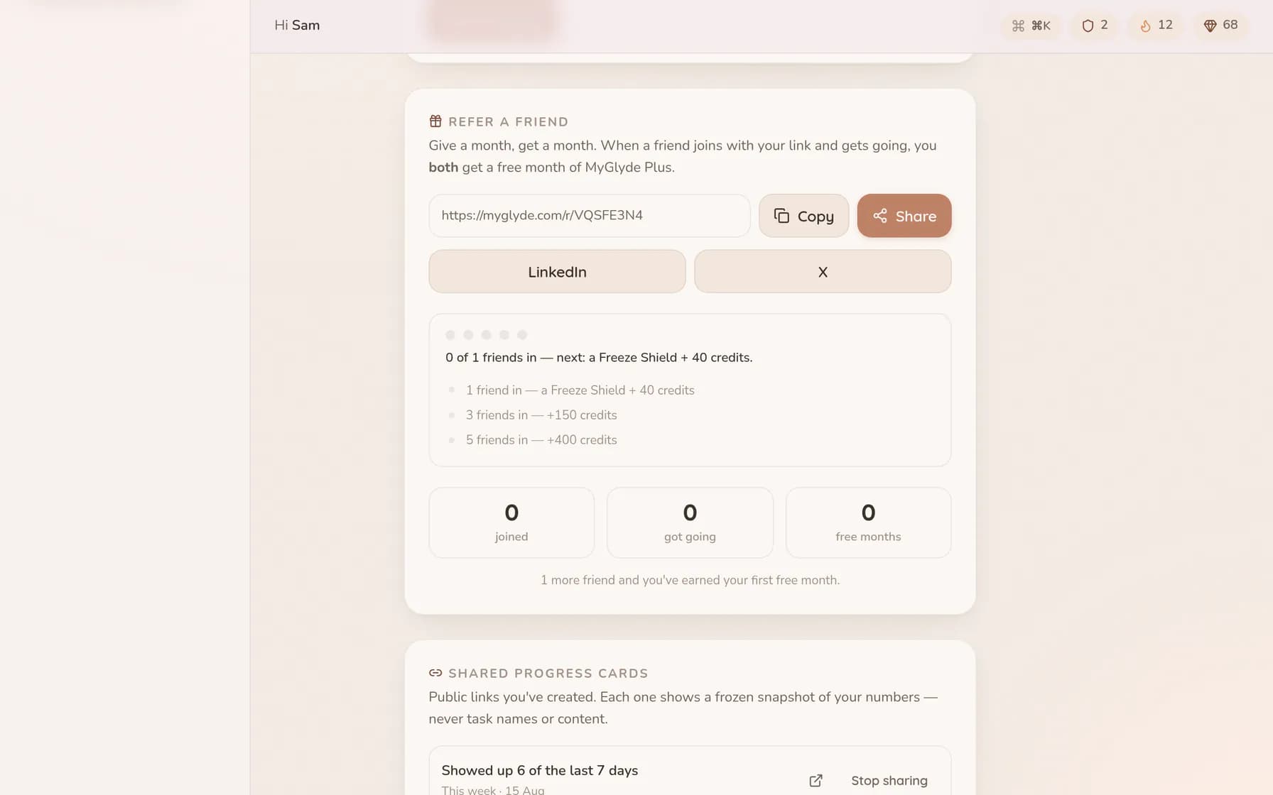 The refer-a-friend panel showing a personal link ready to copy or share, and the reward ladder beneath it: one friend earns a Freeze Shield and 40 credits, three friends 150 credits, five friends 400.